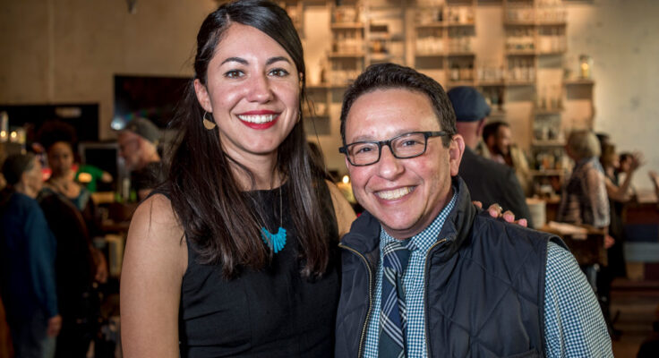 Adriana with her arm around Shafer Mazow at an Arts Grantee Reception.