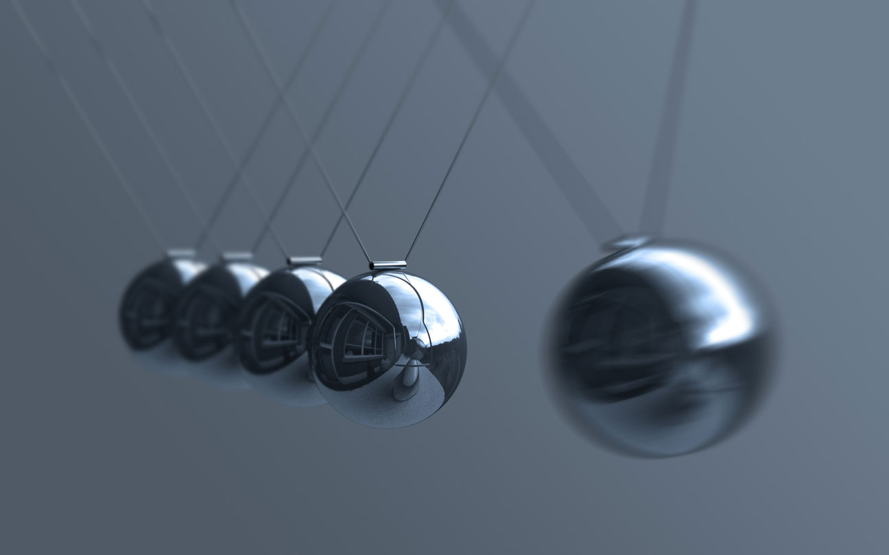five reflective pendulum balls in motion